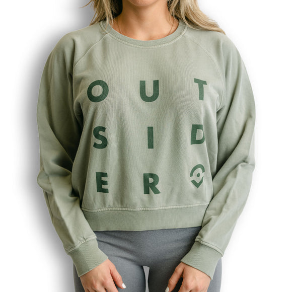 Outsider Women's Crew Neck Sweatshirt in Sage Green with Green logo modeled on a woman